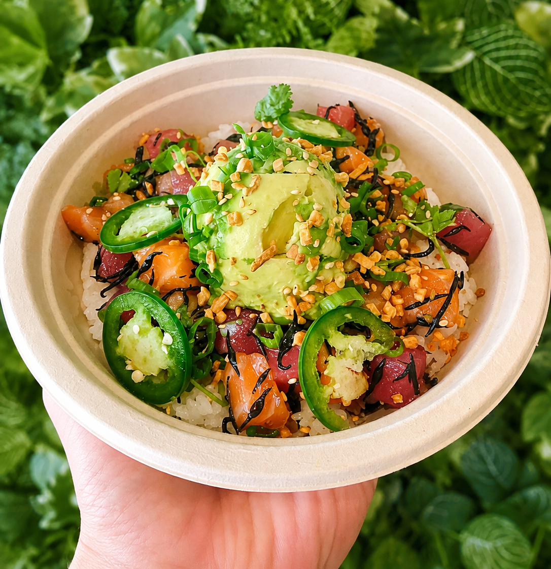 Fresh poke bowl with avocado, salmon and vegetables